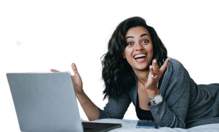 woman with laptop happy