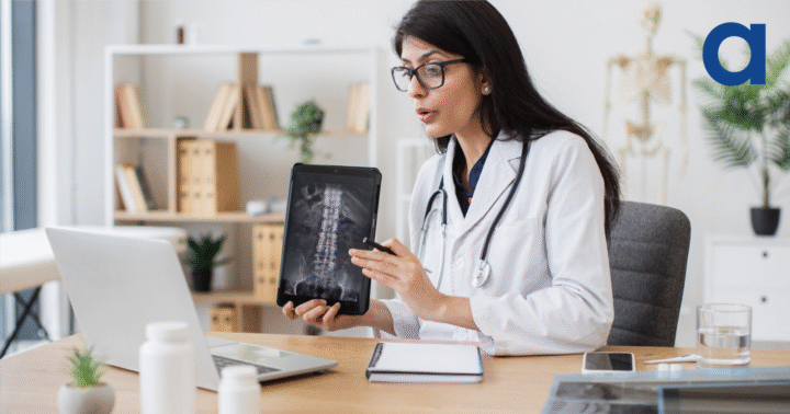 Female doctor using technology to show scan results