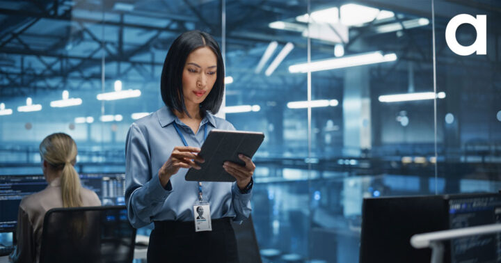 Asian Female Cybersecurity Expert Works on Her Tablet Computer in a Modern Facility, Running Diagnostic Tests to Identify Network Vulnerabilities in a Data Center with Server Racks