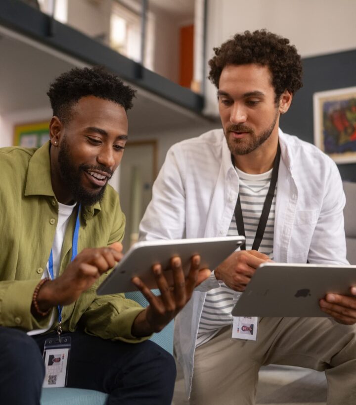 two students researching on tablet